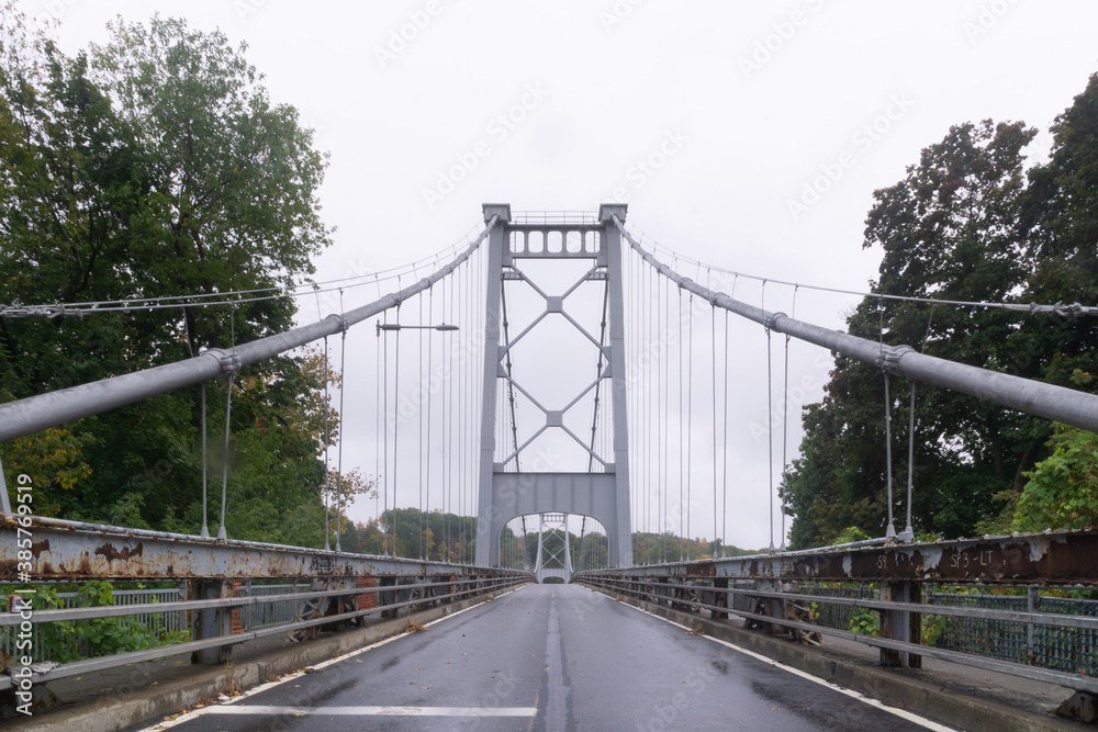 Kingston, NY / United States - Oct.13, 2020: Landscape image of The Kingston–Port Ewen Suspension Bridge also known as the Wurts Street Bridge is a steel suspension bridge spanning Rondout Creek.