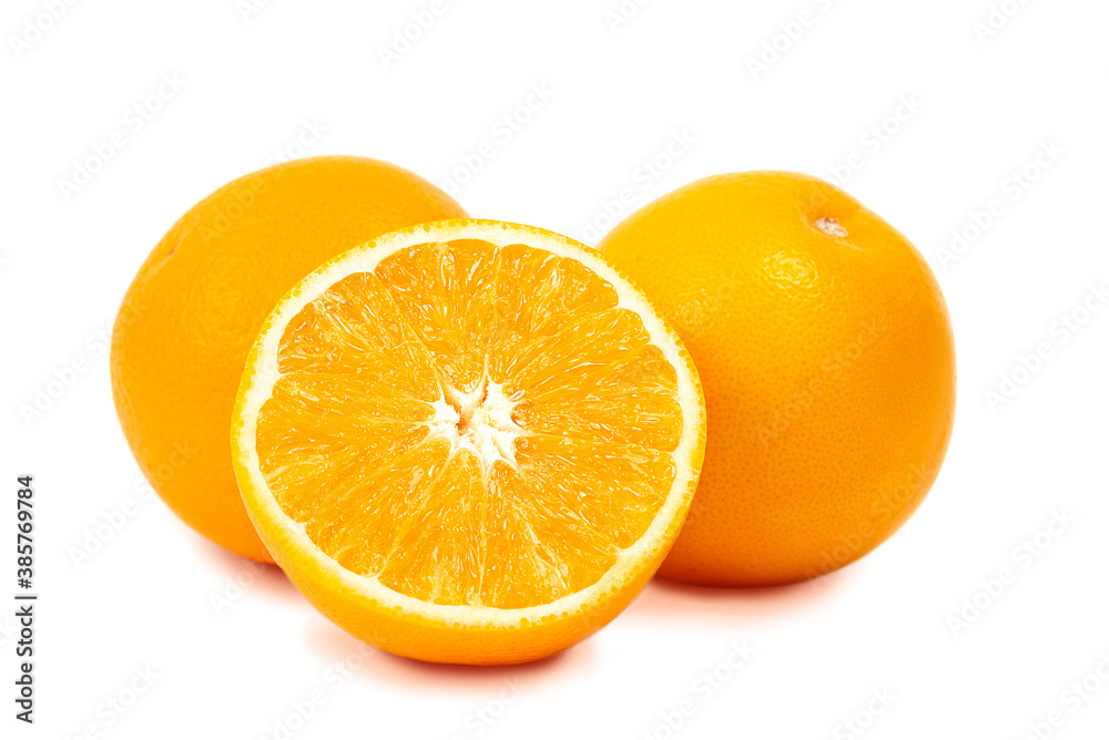 Two whole oranges and half an orange isolated on a white background Two whole oranges and half an orange isolated on a white background