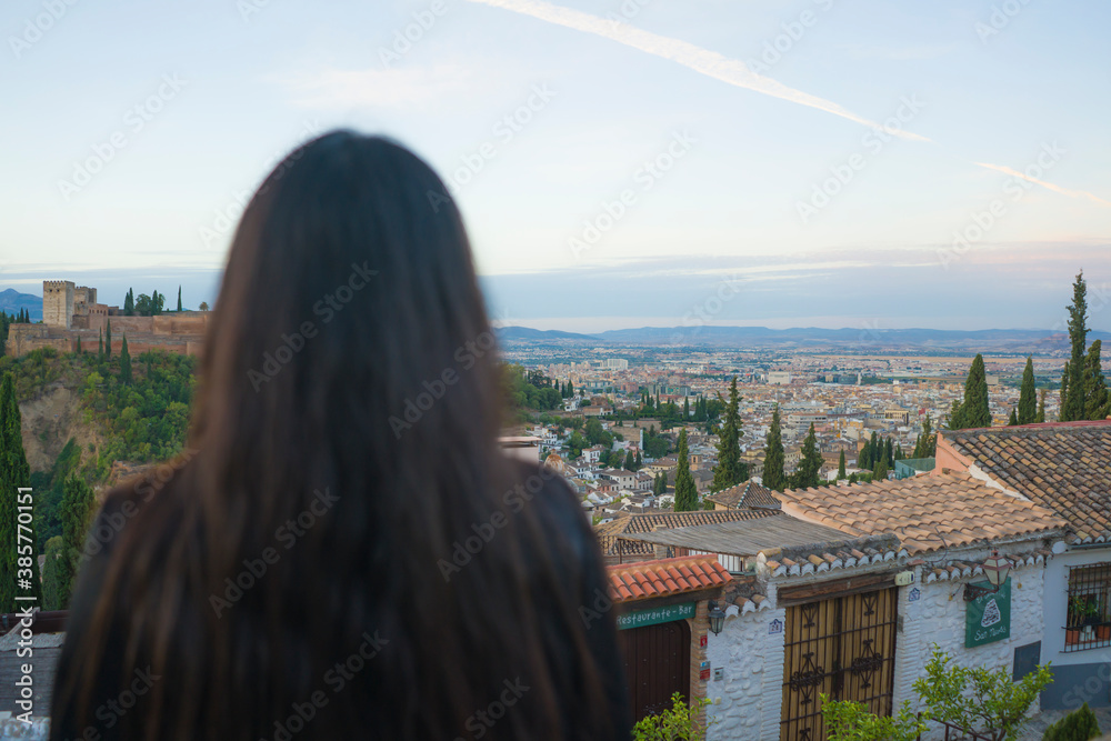 lifestyle back portrait of young beautiful and relaxed woman having Summer holidays in Spain enjoying cheerful beautiful views at Alhambra of Granada in tourism concept lifestyle back portrait of young beautiful and relaxed woman having Summer holidays in Spain enjoying cheerful beautiful views at Alhambra of Granada in tourism concept