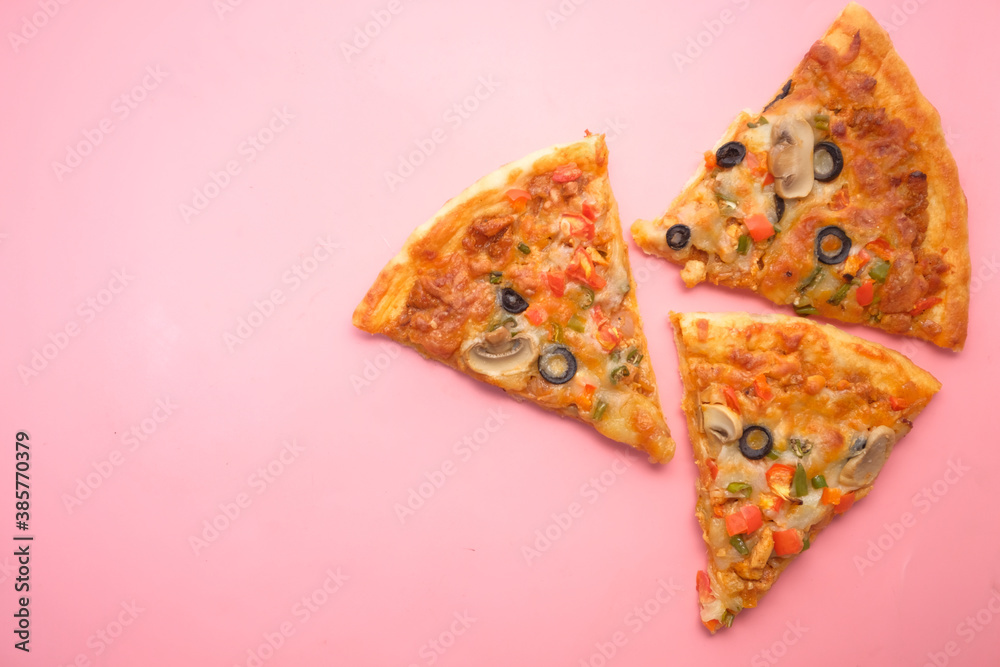 Fototapeta Slice of cheese pizza on a plate on pink background .
