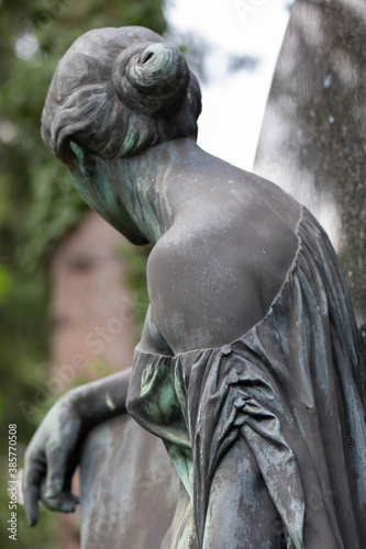 erotische frauenfigur mit entblößter Schulter, Grabmal auf dem Melaten Friedhof,Köln, Nordrhein-Westfalen, Deutschland photo