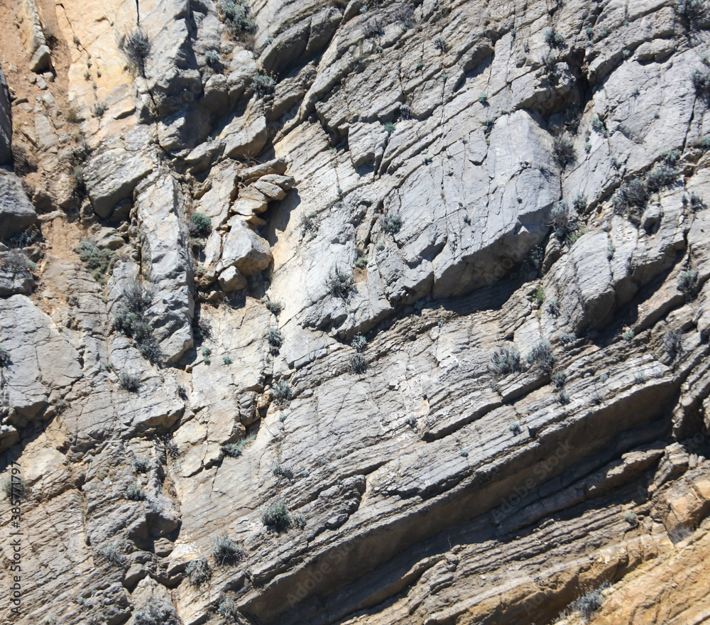 Stone rock in the mountains as an abstract background. Stone rock in the mountains as an abstract background.
