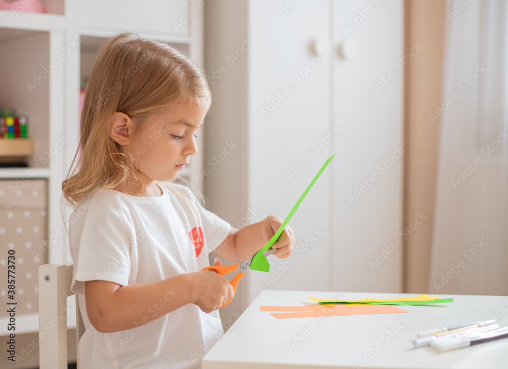 Child teaching scissors skills - happy toddler playtime. Child teaching scissors skills - happy toddler playtime.
