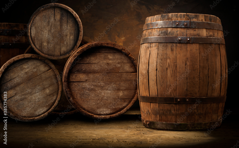 Fototapeta premium Old wooden barrel on a brown background