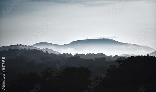 Abstract silhouette mountain anf foggy in morning background