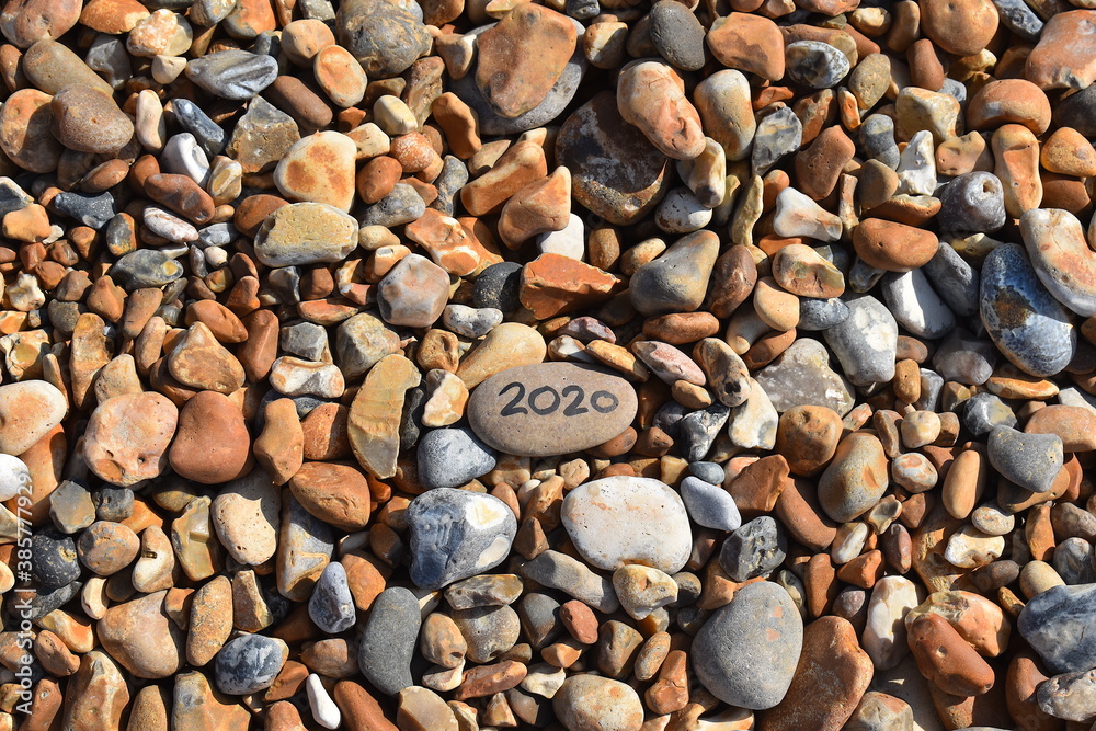 Naklejka premium UK holiday accommodation features huts cottages and hotels for a coastal staycation which is at high demand this year Hastings lifeguarded beach in summertime is mostly made up of sea smoothed pebbles