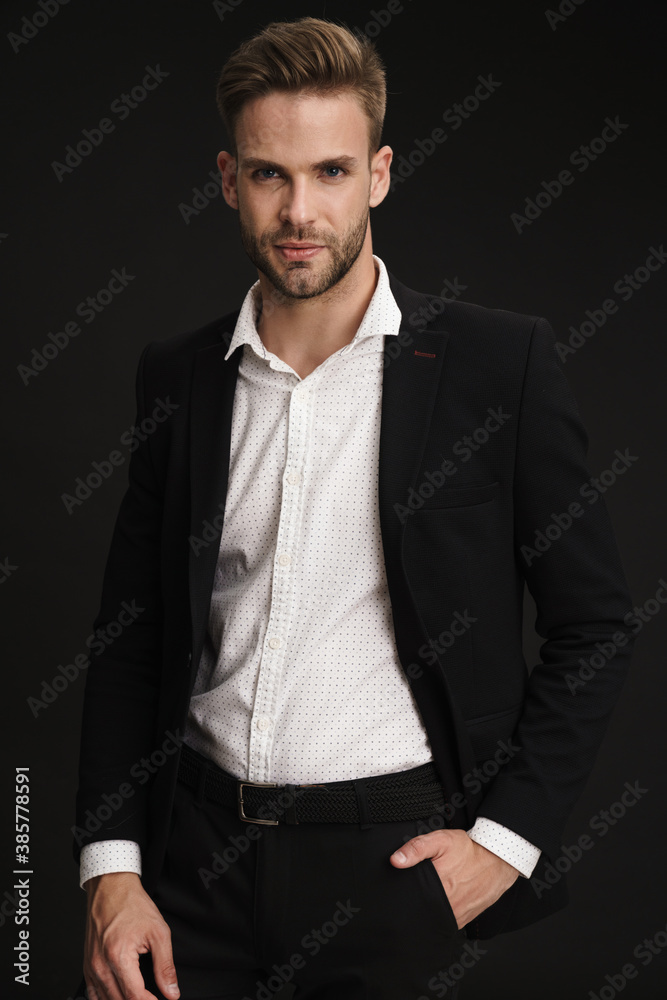 Caucasian confident businessman posing and looking at camera Caucasian confident businessman posing and looking at camera