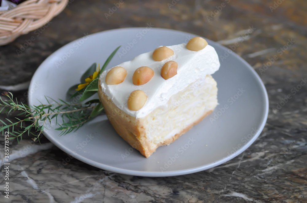 coconut cake with cream and macadamia