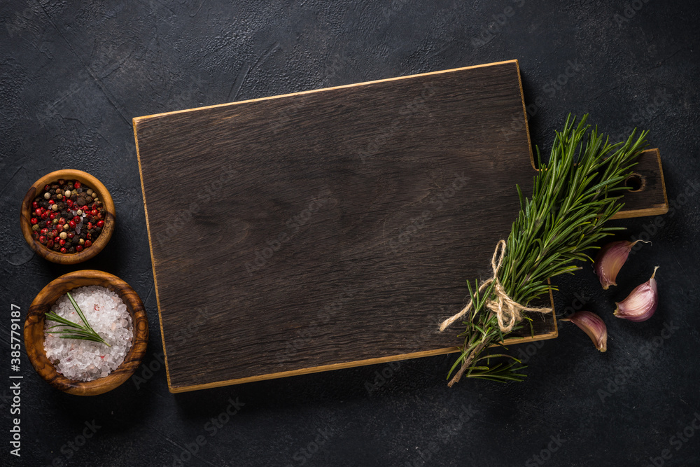 Food cooking background with herbs and spices on black. Stock Photo