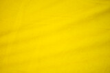 Abstract soft yellow background with streaks shadows waves gradient patterns used as background images copy space.