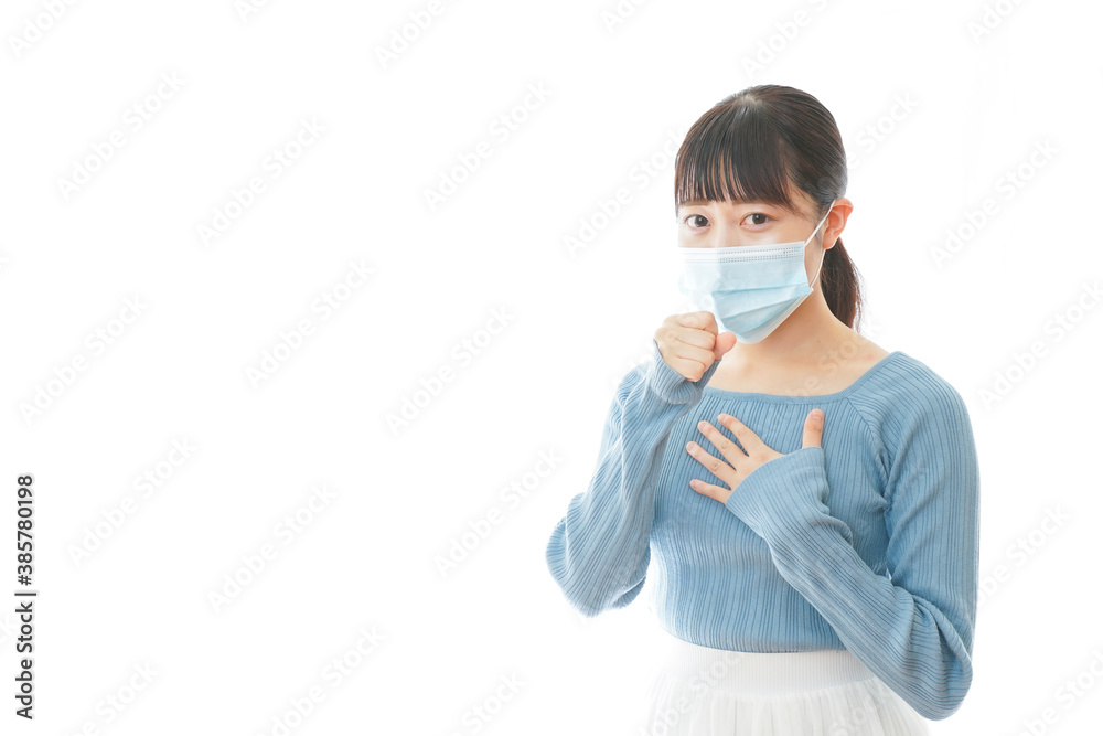体調不良で苦しむマスクを付けた若い女性 体調不良で苦しむマスクを付けた若い女性