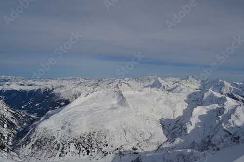 Picturesque winter mountains in a ski resort on snow-capped mountain peaks.