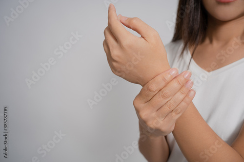 Pain in a waman's body. Asian woman has wrist pain.