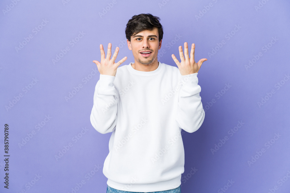 Young cool man showing number ten with hands. Young cool man showing number ten with hands.