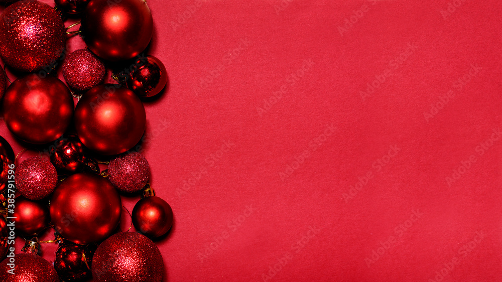 Red Christmas and New year background with christmas bauble frame on red paper with copyspace. Clean elegant minimal holiday design. Flat lay concept. Red Christmas and New year background with christmas bauble frame on red paper with copyspace. Clean elegant minimal holiday design. Flat lay concept.