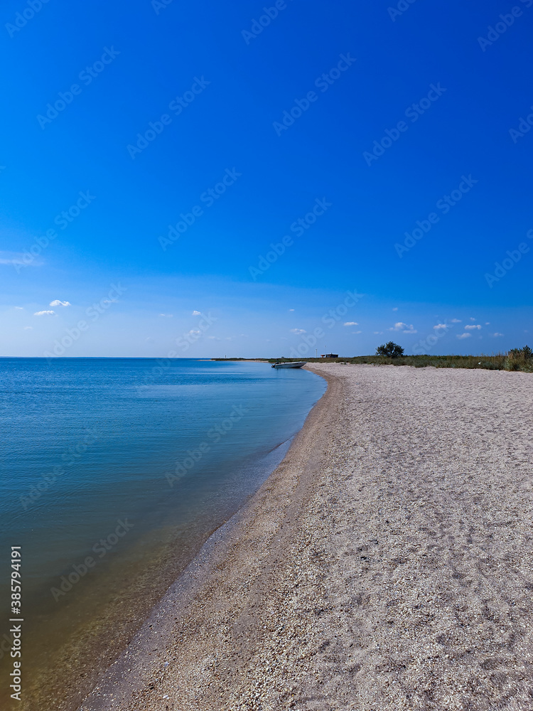 blue sea and white sand coast