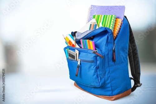 Colored school backpack with school supplies