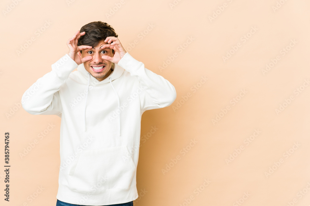 Young cool man keeping eyes opened to find a success opportunity. Young cool man keeping eyes opened to find a success opportunity.
