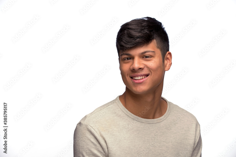 Portrait of young man of Latin decent looking at camera smiling Portrait of young man of Latin decent looking at camera smiling