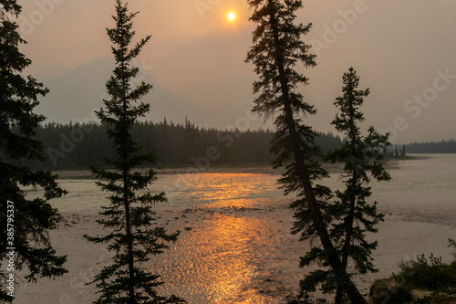 Sunset above the Athabasca river with smoke caused by wildfires, Jasper, Canada