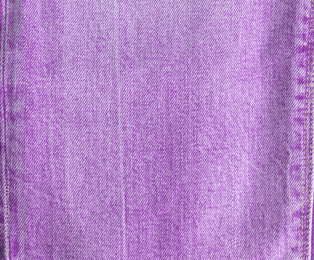 Texture of purple jeans. Denim. View from above. Texture of purple jeans. Denim. View from above.