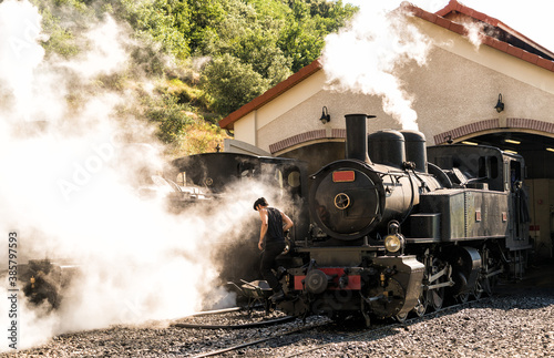 old steam train locomotive in the countryside 