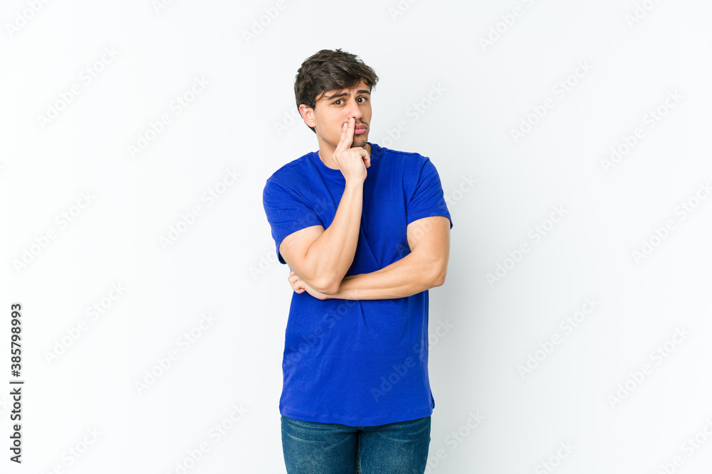 Young cool man unhappy looking in camera with sarcastic expression. Young cool man unhappy looking in camera with sarcastic expression.