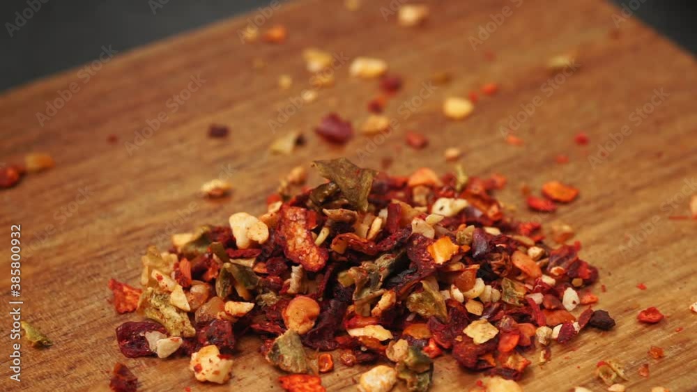 dry spices in a wooden spoon close-up on a vintage background. selective focus