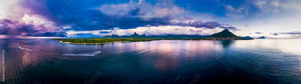 Mauritius, Black River, Flic-en-Flac, Helicopter panorama of Indian Ocean at dusk with island in background
