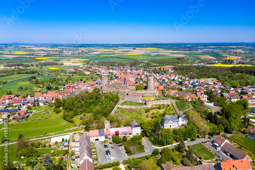 Germany, Hesse, Munzenberg, Helicopter view of Munzenberg Castle and surrounding village in summer photo