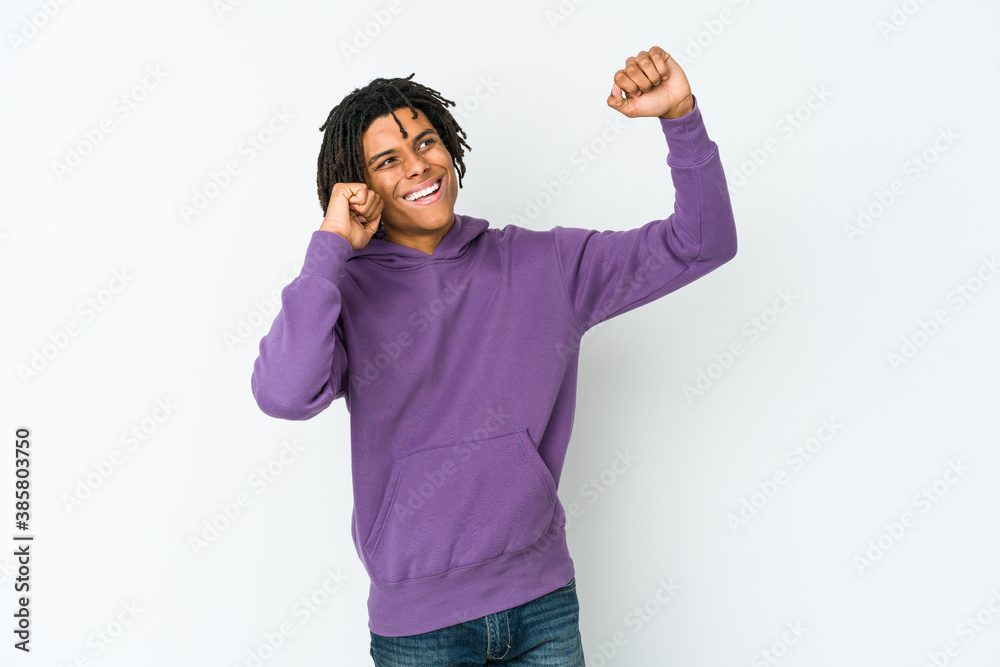 Fototapeta premium Young african american rasta man dancing and having fun.