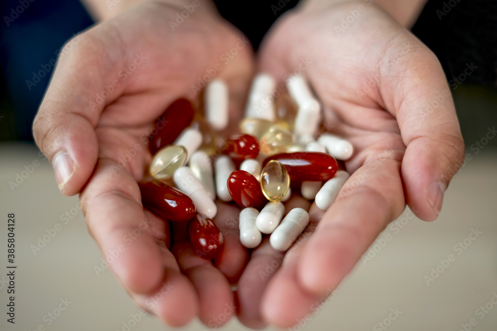 Many pills and vitamins in the hands of doctor Many pills and vitamins in the hands of doctor