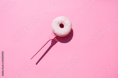 Studio shot ofÔøΩfork with sweet doughnut photo