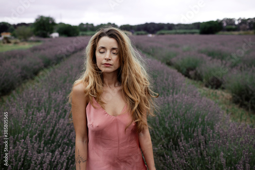 Woman standing in lavender field photo