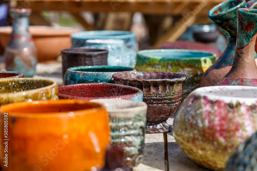 Beautifully crafted clay pots for gardening and decoration. Modern design and interior style details.Colorful ceramic pots for the selling. © mitsyko1971