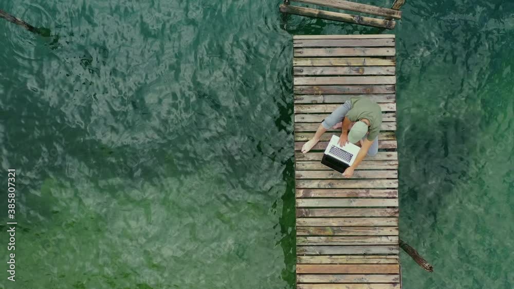 Caucasian Men and His Online Job During Summer Vacation. Working While on Vacation Theme