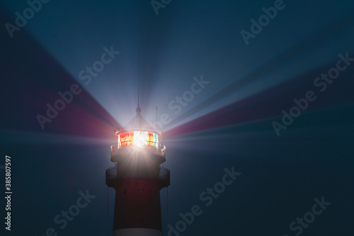 Germany, Schleswig-Holstein, Westerhever, Top of Westerheversand Lighthouse glowing at dusk
