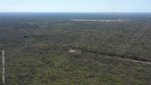 Wallpaper Mural Dzibilchaltun Mayan ruins from the air as aerial camera pushes in. Torontodigital.ca