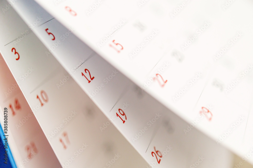 Calendar page flipping sheet close up on office table background business schedule planning appointment meeting concept