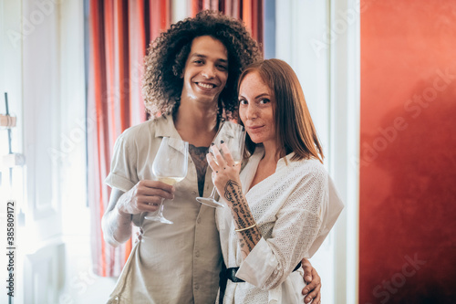 Couple with wineglass during party at home photo