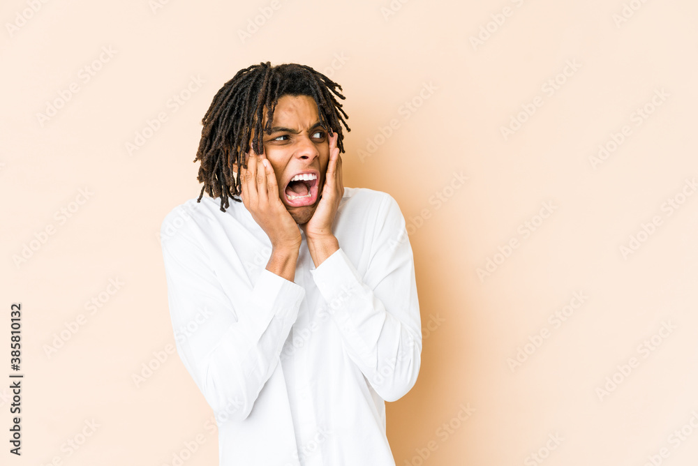 Young african american rasta man scared and afraid. Young african american rasta man scared and afraid.
