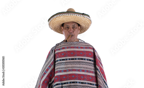 portrait of a mexican old man in a poncho on a white background