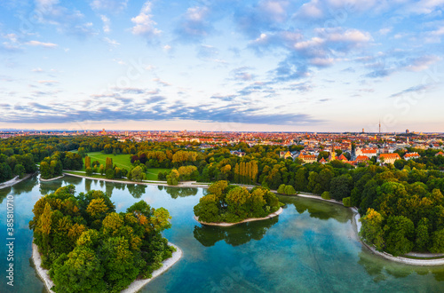 Germany, Bavaria, Munich, Drone view of Kleinhesseloher See and Electors Island in English Garden at dawn photo