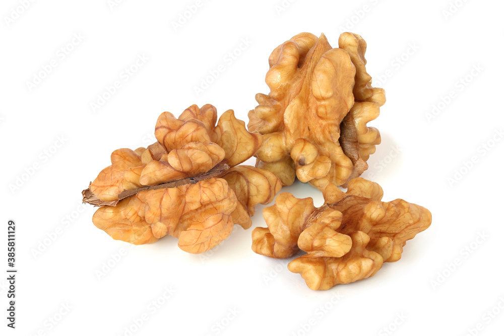 Two cores and half of walnuts isolated on the white Two cores and half of walnuts isolated on the white
