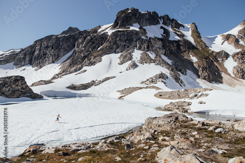 Man running across the quickly melting White Rock Lakes