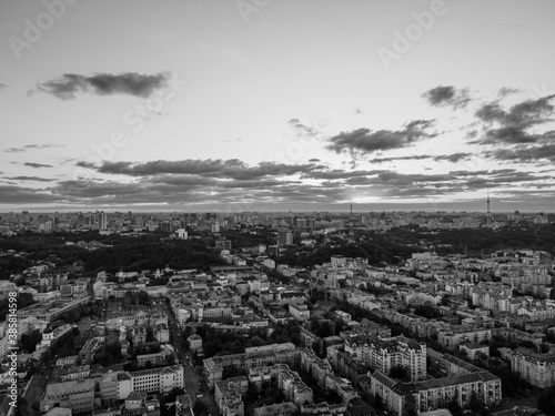 Aerial view of the big city at sunset © Hennadii