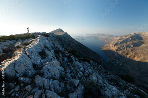 Woman running on mountain ridge