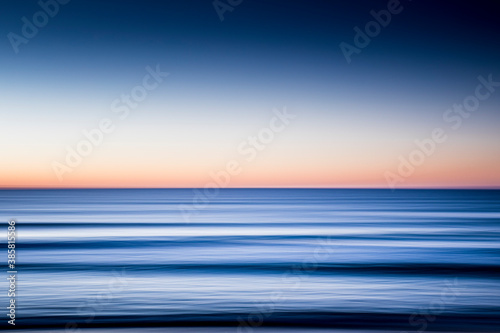 Obraz na plátně Blurred motion of sea at dawn