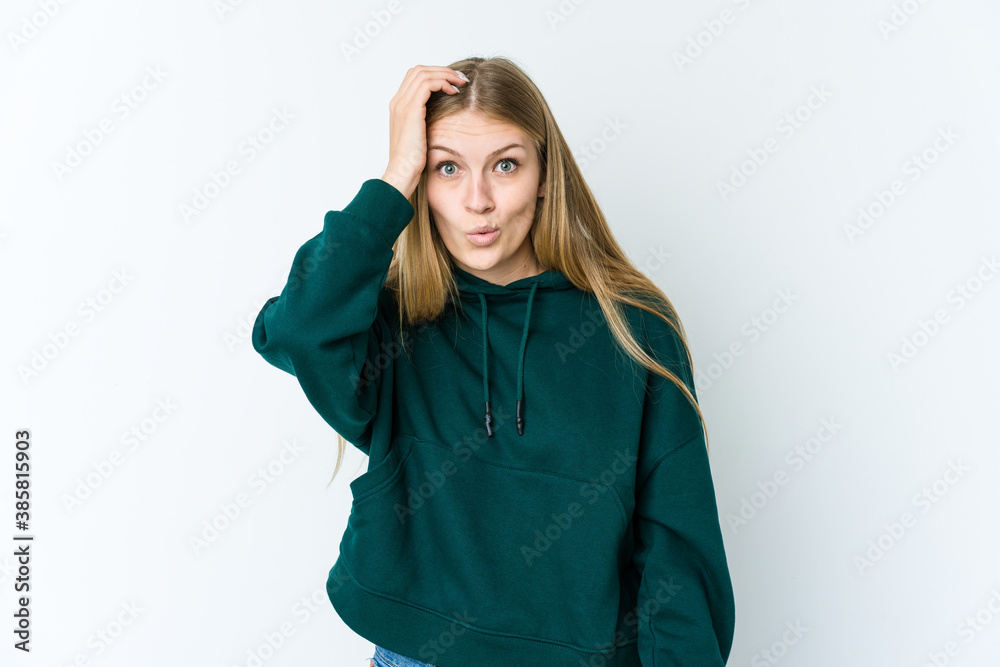 Young blonde woman isolated on white background being shocked, she has remembered important meeting. Young blonde woman isolated on white background being shocked, she has remembered important meeting.