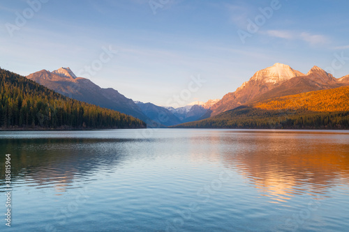 Autumn colors and mountains reflecting in Bowman Lake photo